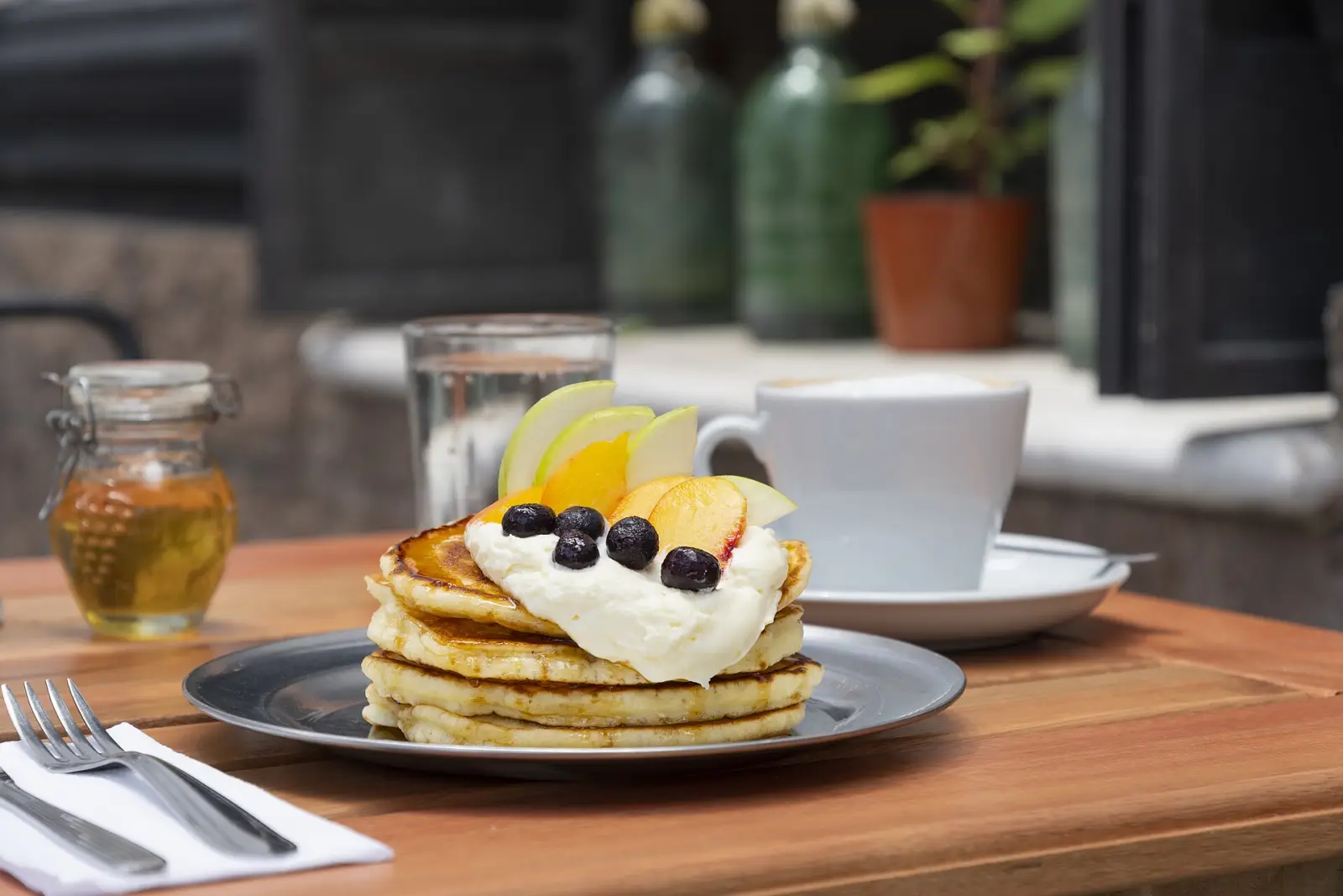 Pancakes and coffee on a cafe table. The photo was not taken at an Orlando restaurant.