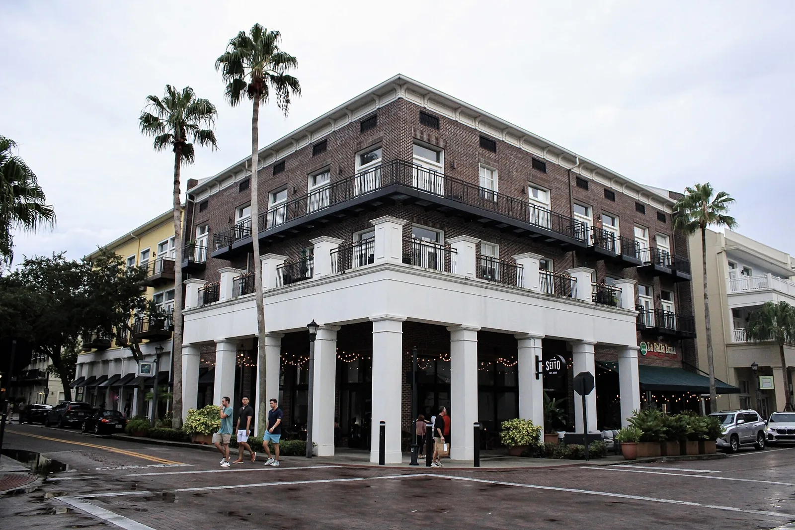 Restaurants on the ground floor of a corner building in Baldwin Park's village center, Orlando