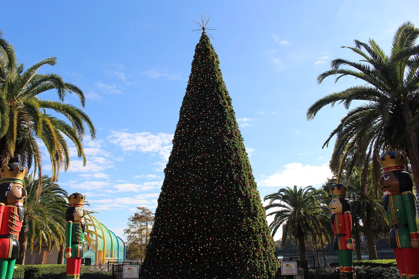 The Lake Eola Wonderland Christmas tree, flanked by nutcracker figures, in Lake Eola Park