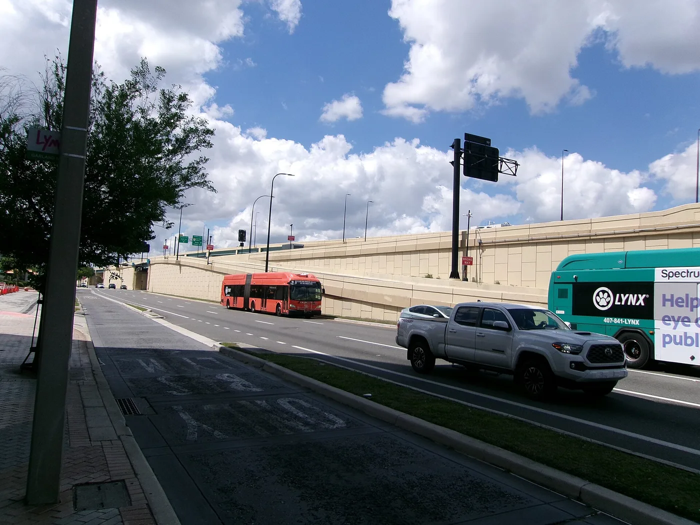 A LYNX bus and traffic on North Garland Avenue near LYNX Central Station in downtown Orlando