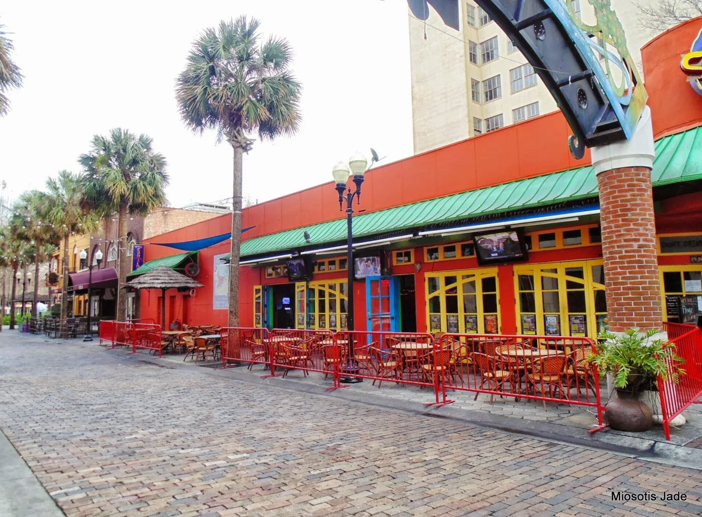 Restaurant patios on a brick-paved street in downtown Orlando