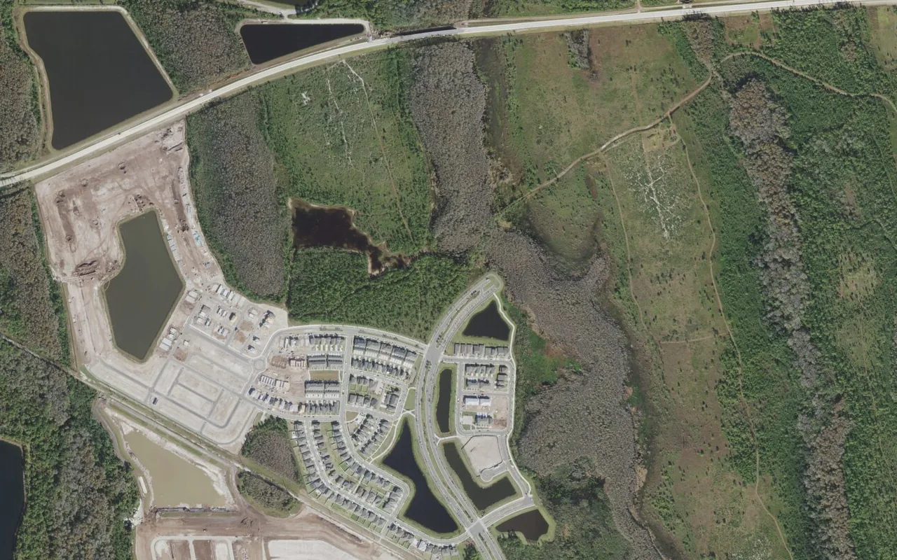 Innovation High School's campus (center) and the neighborhood around it on Dowden Road in Orlando, seen from the air