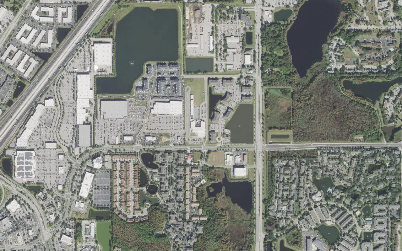 Millennia Gardens Elementary School's campus (center) and the neighborhood around it on Gardens Ridge Way in Orlando, seen from the air
