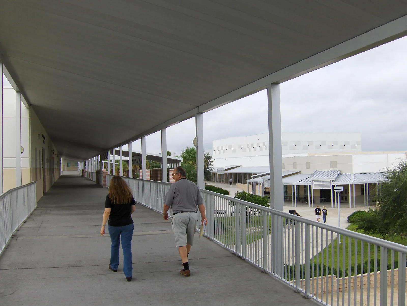 A covered walkway and classroom buildings at Olympia High School on South Apopka Vineland Road