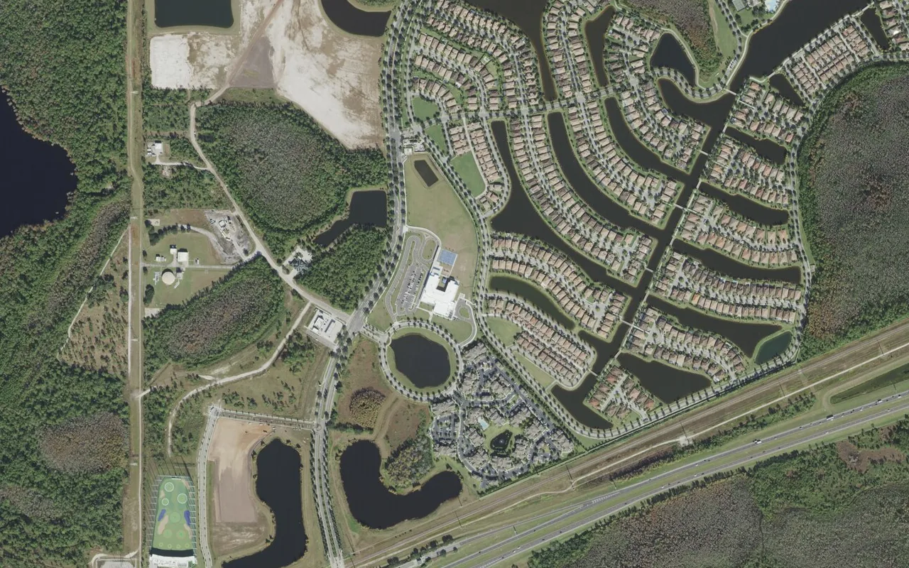 Village Park Elementary School's campus (center) and the neighborhood around it on Lake Nona Gateway Road in Orlando, seen from the air