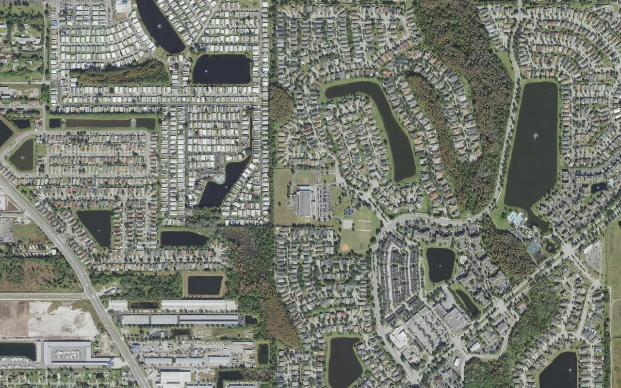 Vista Lakes Elementary School's campus (center) and the neighborhood around it on Lake Champlain Drive in Orlando, seen from the air