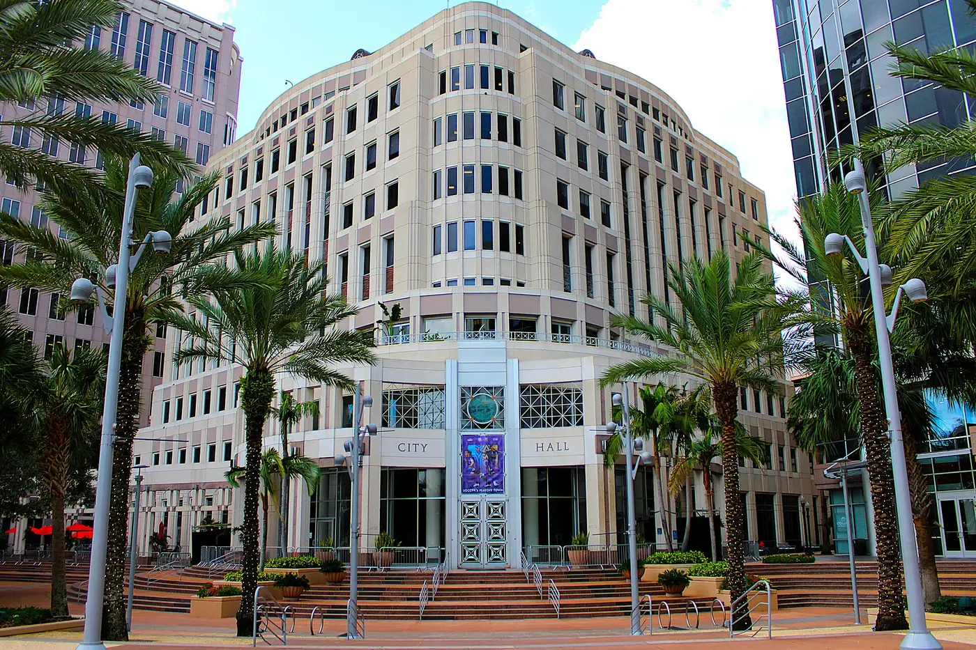 Orlando City Hall and its plaza on South Orange Avenue, framed by palm trees